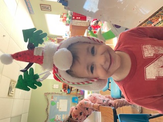 Student wearing a holiday hat