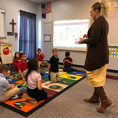 students engaged in teacher lesson