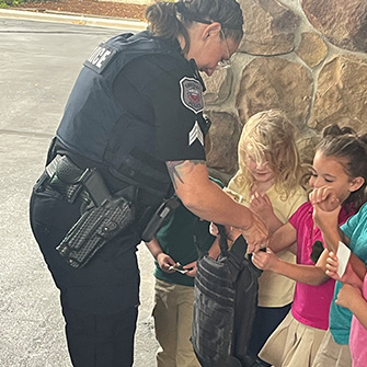 Students talking to an officer