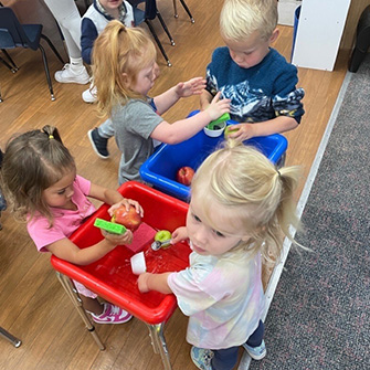 Students washing apples