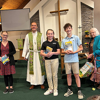 Mission Circle presenting Bibles to new students