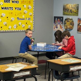 Students putting a puzzle together